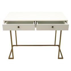 Modern white dressing table, rectangular top above two frieze drawers with bronze metal handles, upon square metal supports