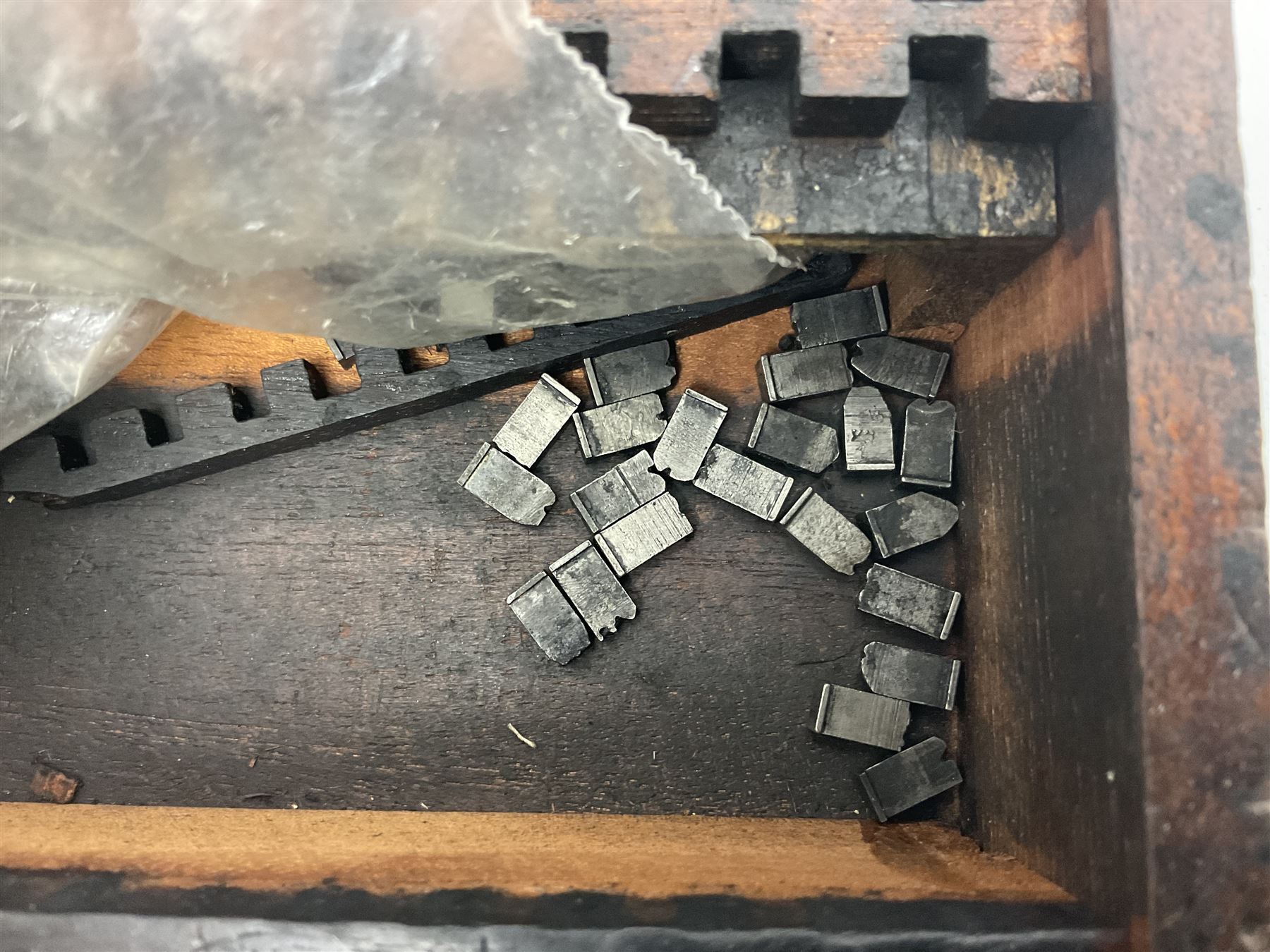 Two Post Office hand stamps 'Heversham Milnthorpe Cumbria' and 'Cimla Neath', together with two hand stamp bodies and various date numbers, housed in a fitted box