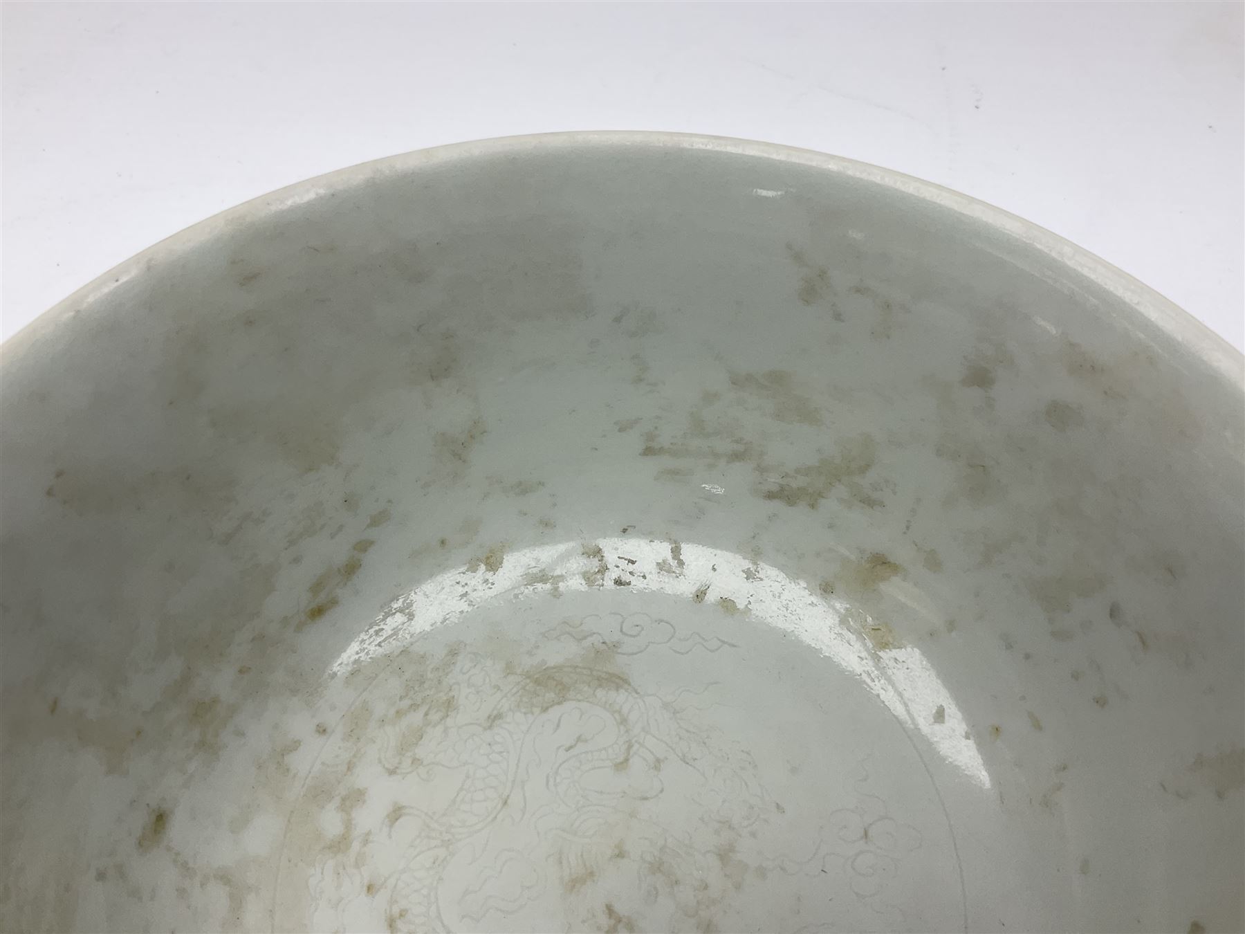 Pair of Chinese famille jaune bowls, decorated in green enamel with a dragon chasing a flaming pearl amongst clouds, upon a yellow ground, the interior decorated to centre with dragon, with six character mark beneath, D17.5cm