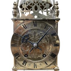 English - 20th century 8-day lantern clock in period 18th century style, square brass case surmounted by a domed bell, with a brass chapter, engraved dial centre and stylised period steel hands, with a two train spring driven movement striking the hours and half hours on a bell. With pendulum. 