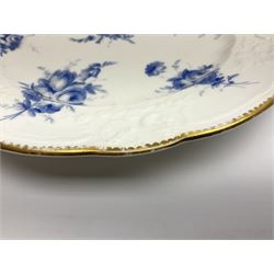 Early 19th century Nantgarw 'Lady Seaton' porcelain plate, circa 1820, hand painted with cobalt blue enamel floral sprays, with shaped and scroll moulded rim within a gilt line, with impressed marks beneath, D25cm
