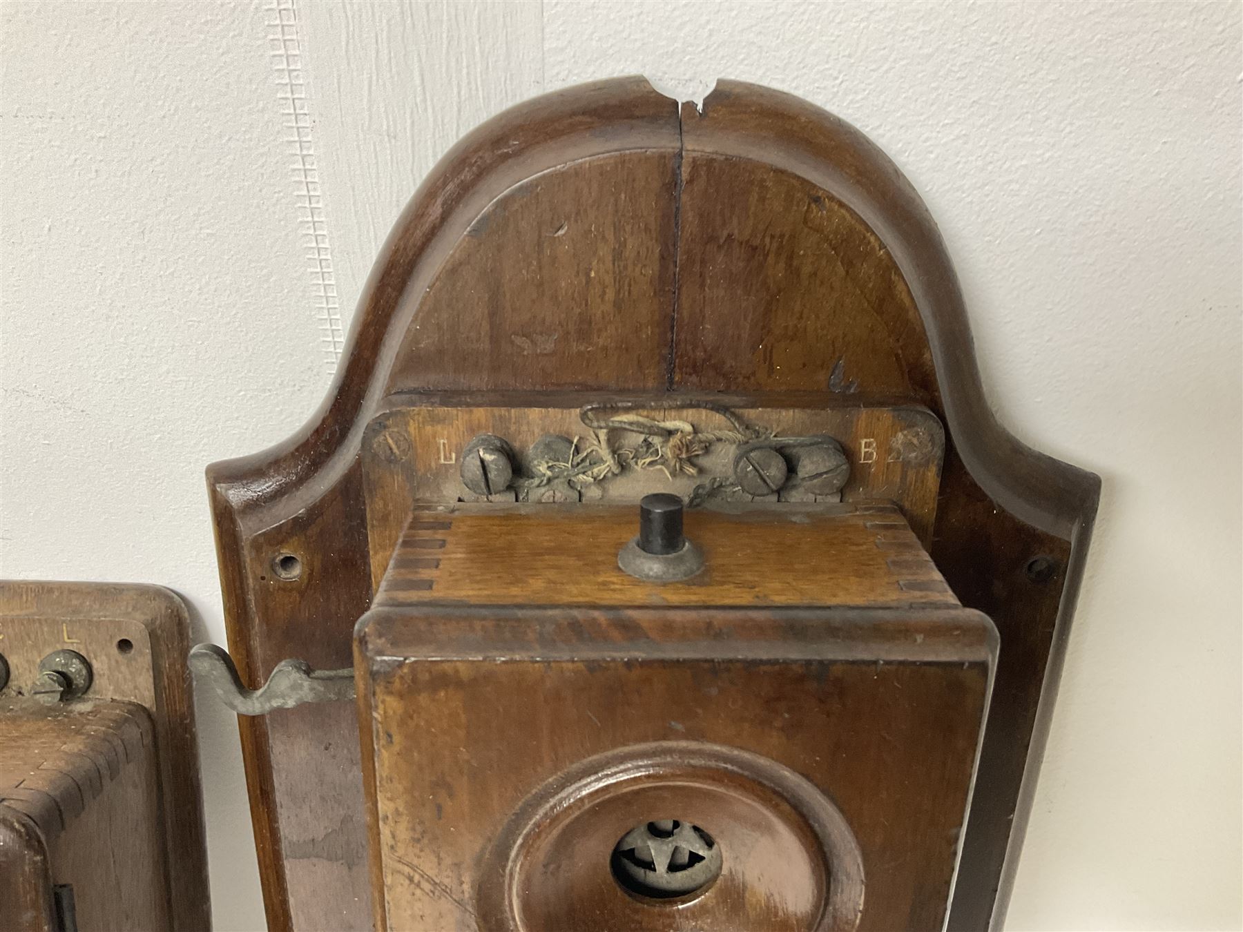 Two Hunningscone patent wall mounting telephones in walnut casing, together with Sterling Telephone & Electric Co. Ltd early wall-mounted telephone 'Primax' and one other 