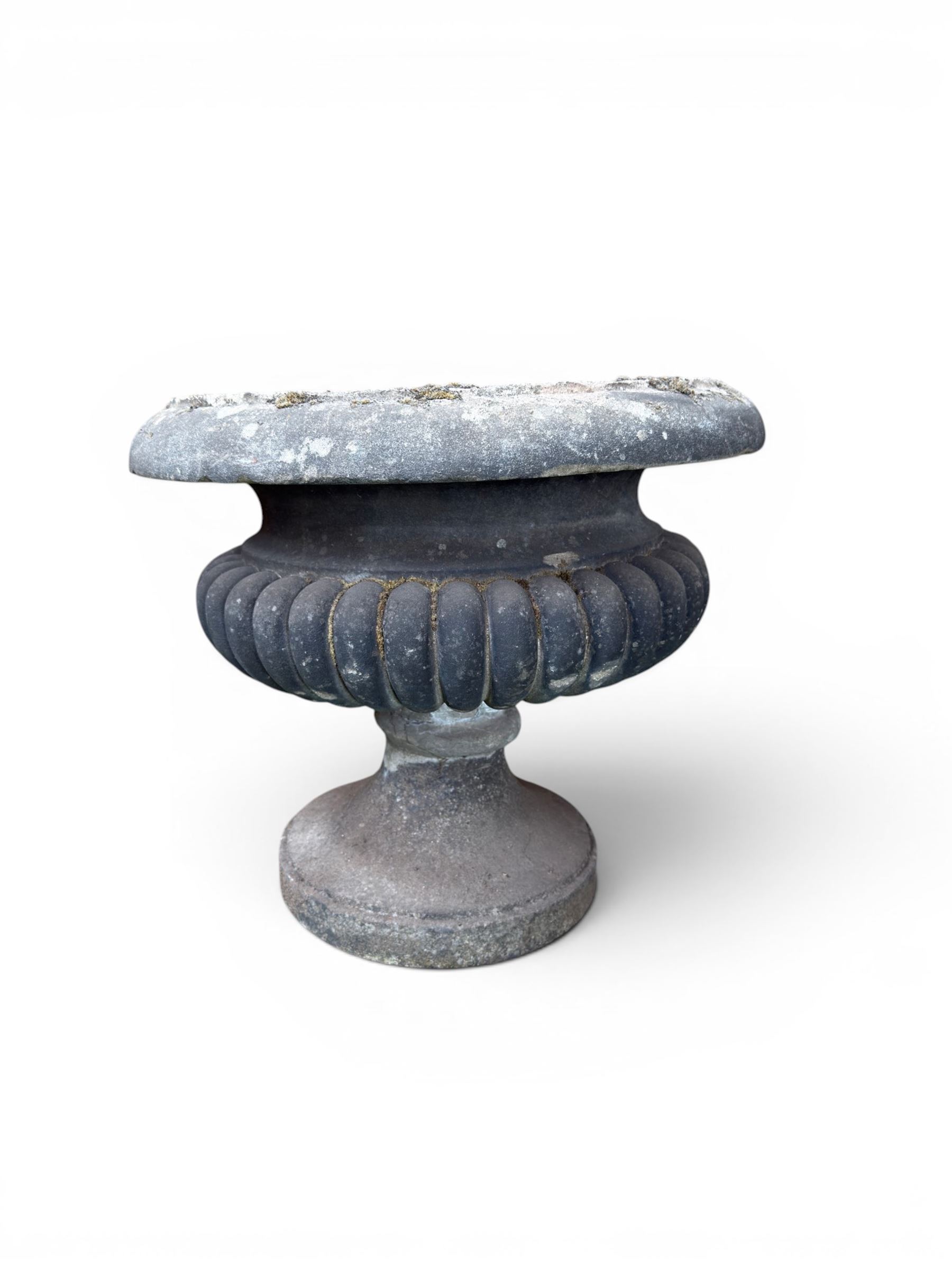Carved sandstone garden urn, gadrooned campana form