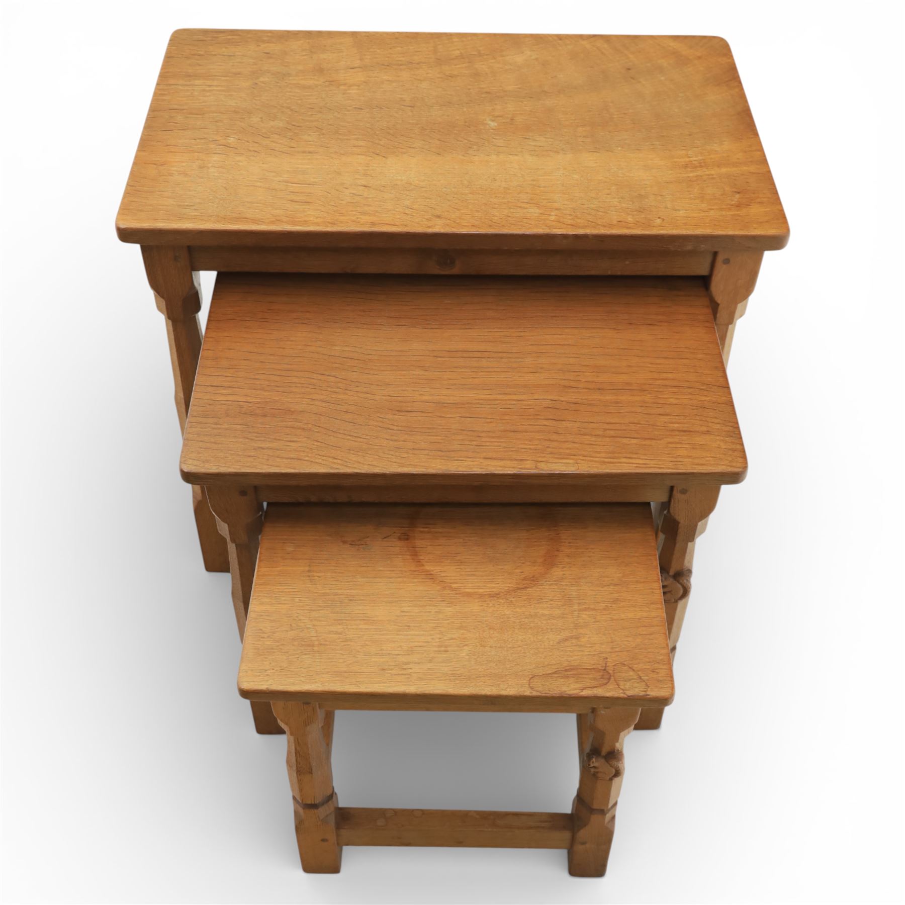 Squirrelman - nest of three tables, each with rectangular top upon octagonal turned supports with squirrel carving, by Wilfrid Hutchinson, Husthwaite