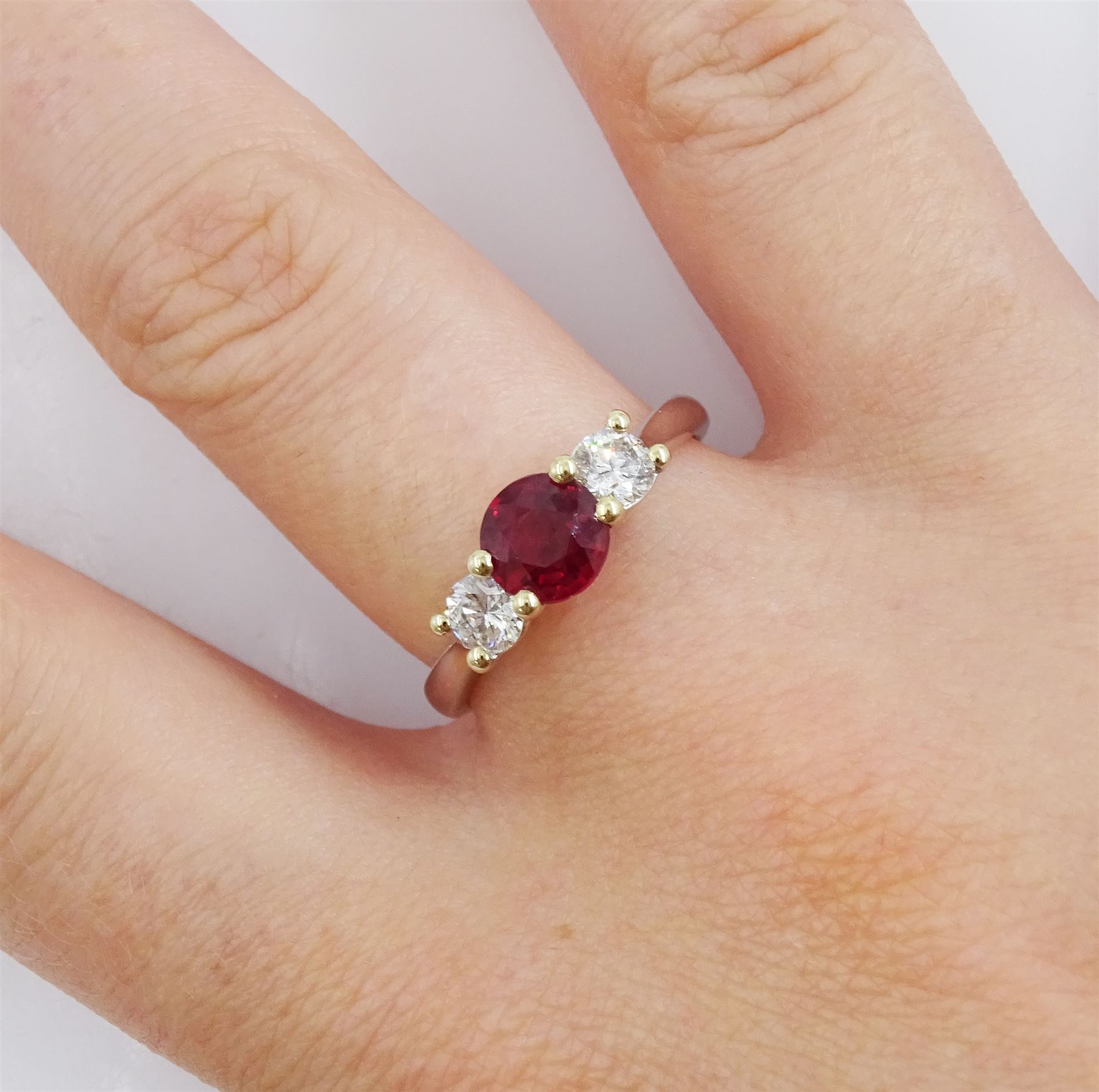 18ct white gold three stone ruby and round brilliant cut diamond ring, hallmarked, ruby approx 1.00 carat, total diamond weight approx 0.50 carat