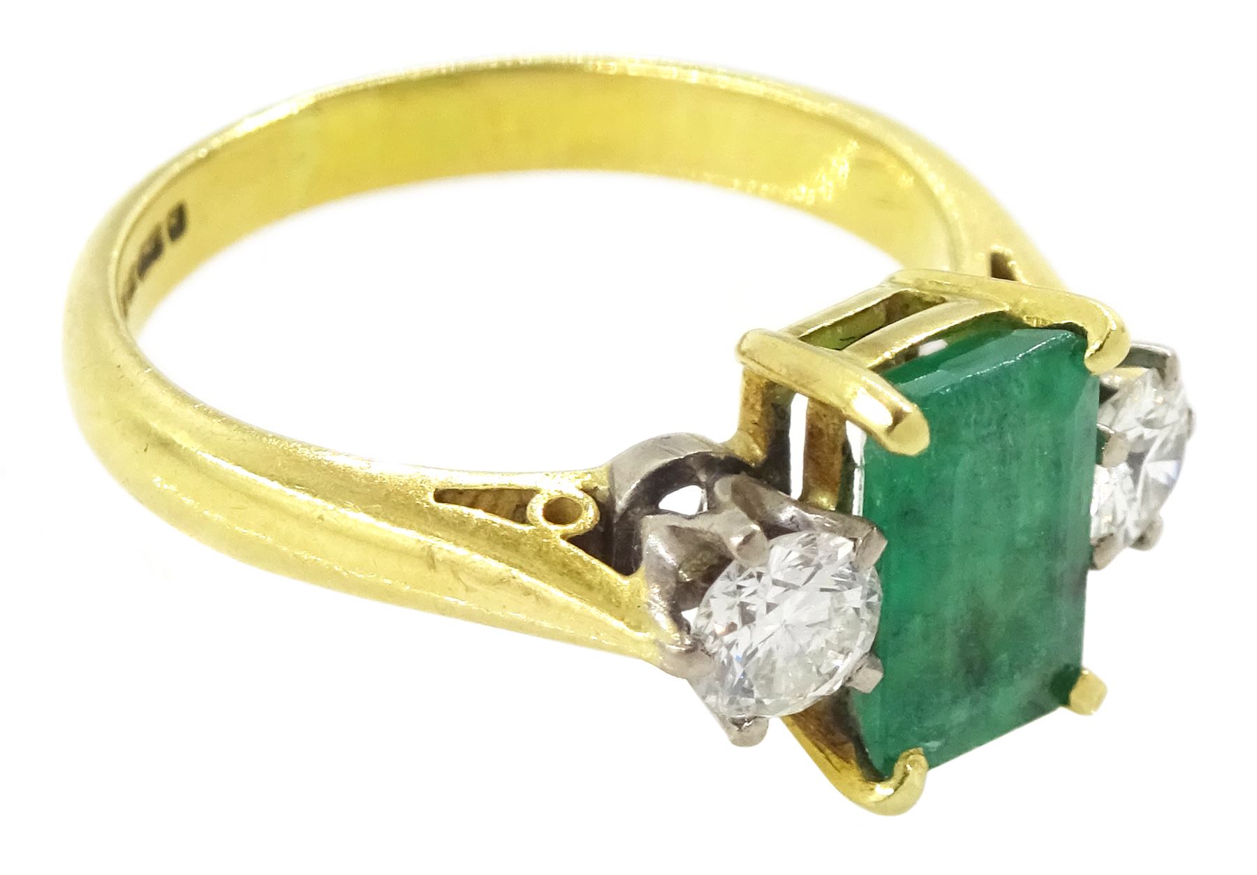 18ct gold three stone octagonal cut emerald and round brilliant cut diamond ring, Sheffield 1981, emerald approx 0.80 carat, total diamond weight approx 0.35 carat