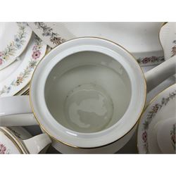 Royal Albert Paragon tea and dinner service for twelve decorated in the Belinda pattern, comprising fourteen saucers, twelve teacups, thirteen side plates, teapot, sauce boat and stand, salt and pepper shakers, two jugs, sucrier, twelve dinner plates, twelve smaller plates, two lidded tureens, twelve bowls, twelve smaller bowls, cake plate, oval plate and oval dish (100)