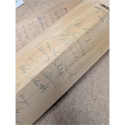 Two signed cricket bats, with signatures including Colin Cowdrey