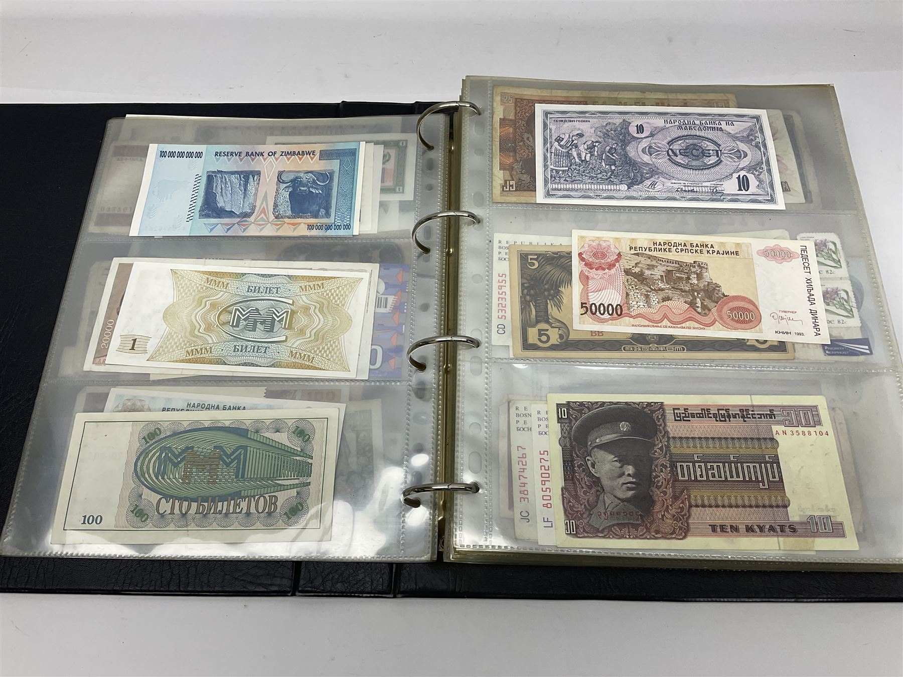 World and Great British banknotes to include Brazil, Canada, France, Germany, Ghana, Indonesia, Iraq, Hong Kong, Hungary, Japan, Vietnam, Zimbabwe, a collection of Chinese ‘Hell Money’, and quantity of ‘De La Rue Systems’ test notes, housed in ring binder and loose