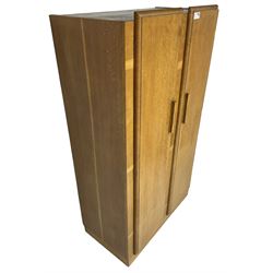 Early 20th century Art Deco period oak Gentleman's wardrobe, the interior fitted with shelves, hanging rails and two long drawers