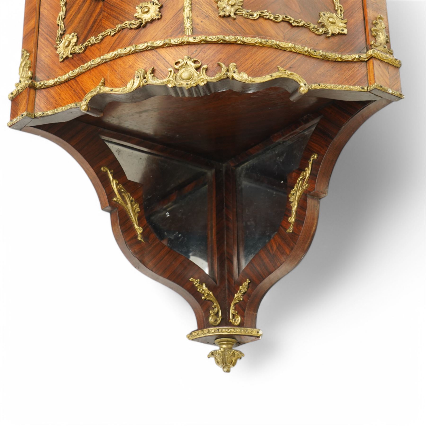 Pair of late 19th to early 20th century Kingwood and ormolu mounted encoignure or wall hanging corner cabinets, shaped end supports with mirror backs, serpentine double cupboard mounted by sevres design porcelain panels, decorated with foliate cast metal mounts, the interior fitted with shelf