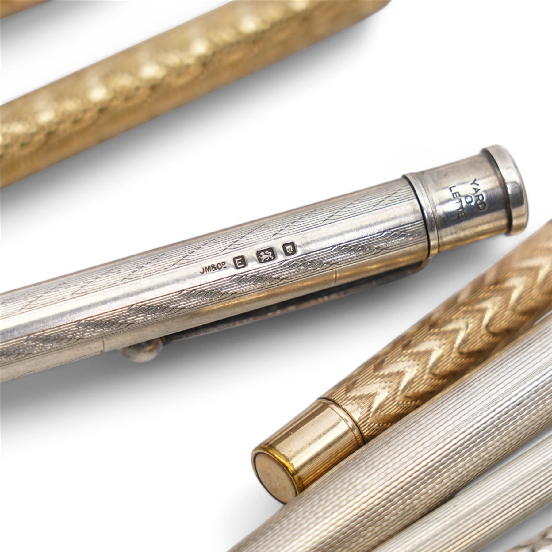 Propelling pen/pencil in gilt metal embossed case, Yard o Lette silver pencil,  silver bridge marker, two other silver pencils and two rolled gold pencils