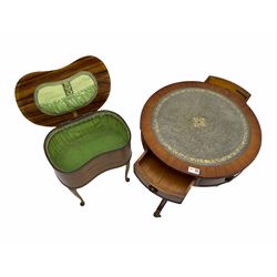 Reproduction mahogany drum table with leather inset, a kidney shaped sewing box on cabriole supports and a pair of Edwardian chairs with cane seats