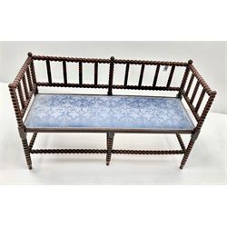 Late Victorian beech framed two seat bobbin bench, upholstered seat