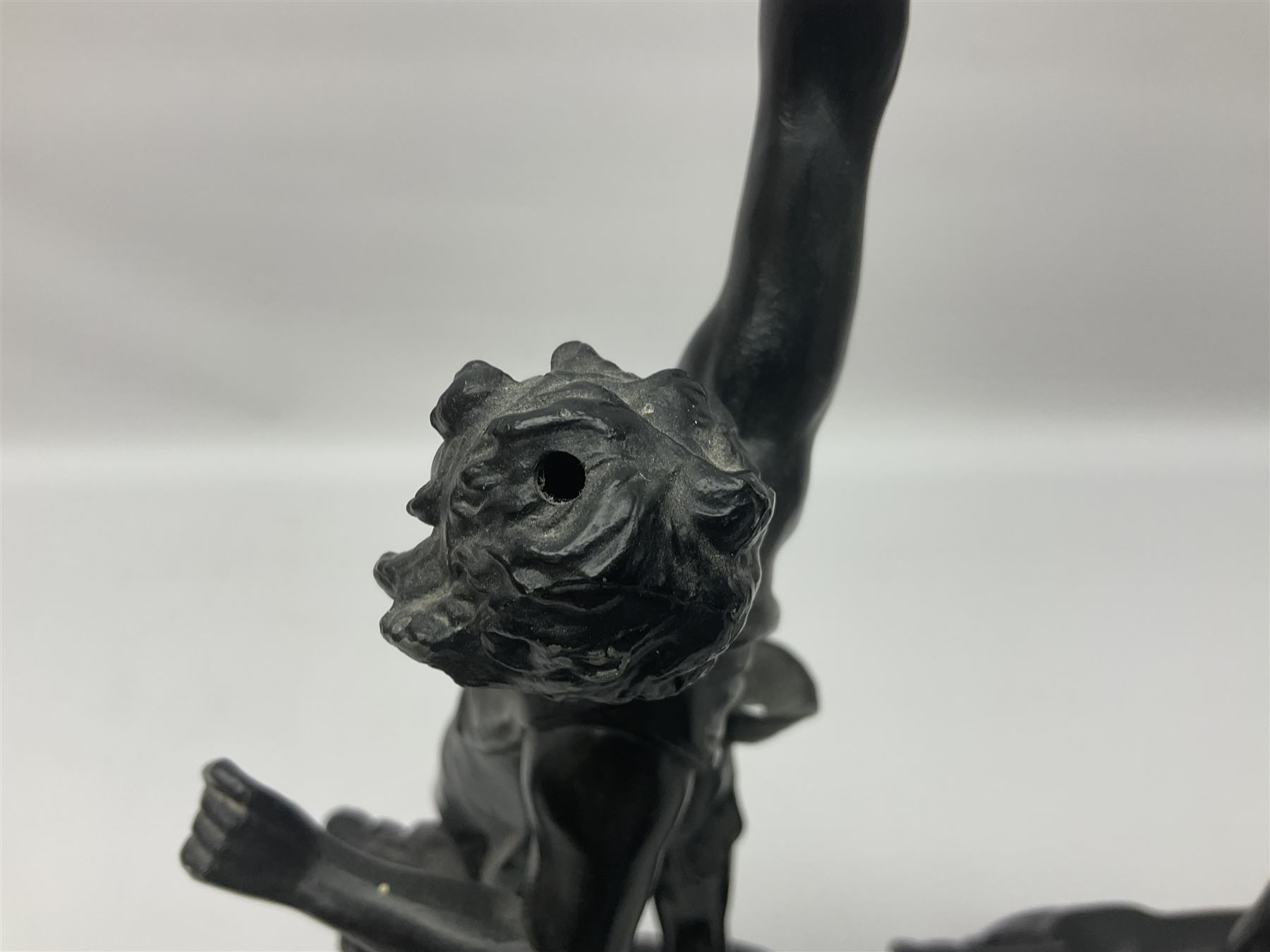 Pair of spelter figures, Le Force and Le Pouvoir, modeled as figures standing on lions, arms held aloft, H51cm 