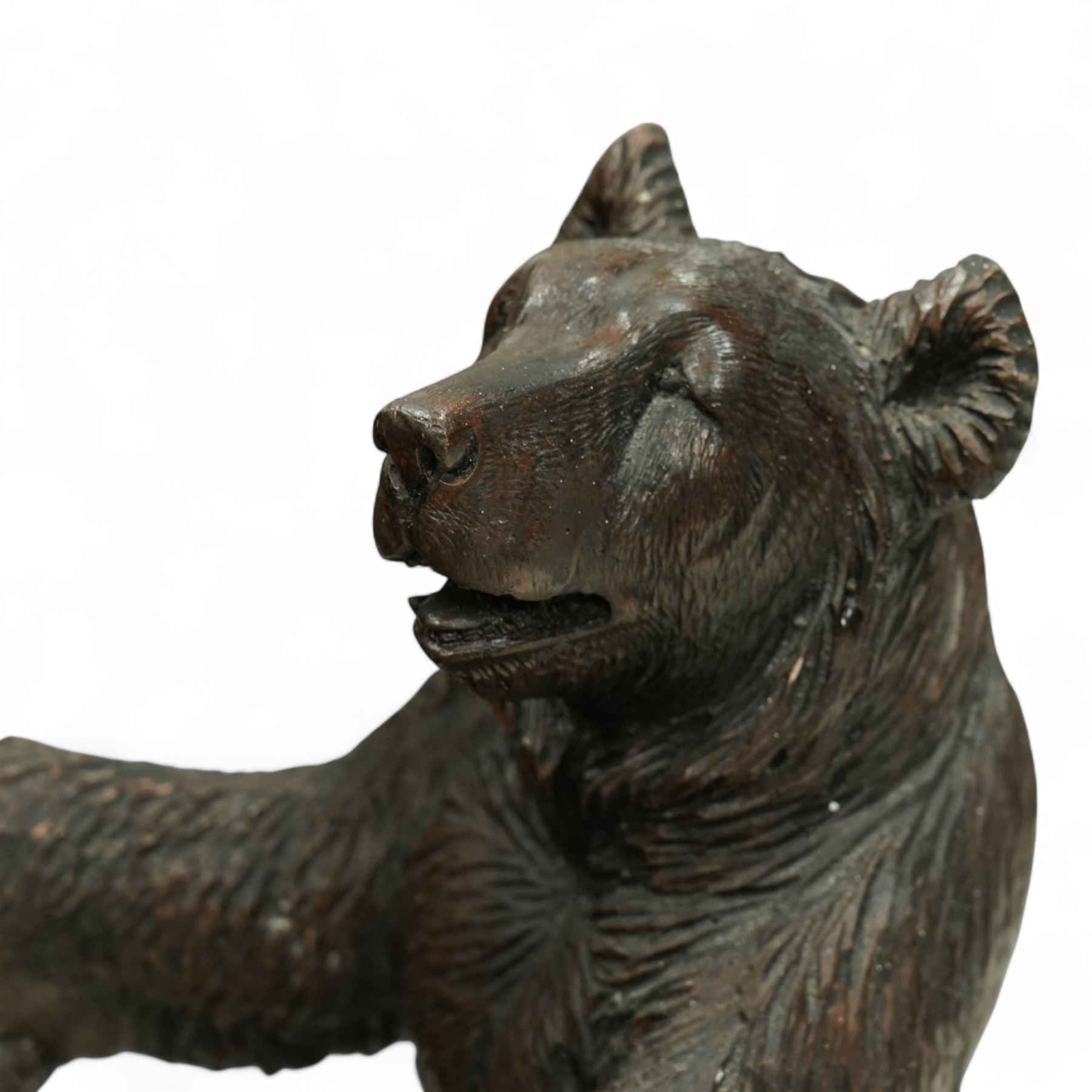 Early 20th century Black forest bear design stick stand, composite wood model of a bear with arms outstretched holding a branch forming the stick stand above a drip tray on tree branch form feet 