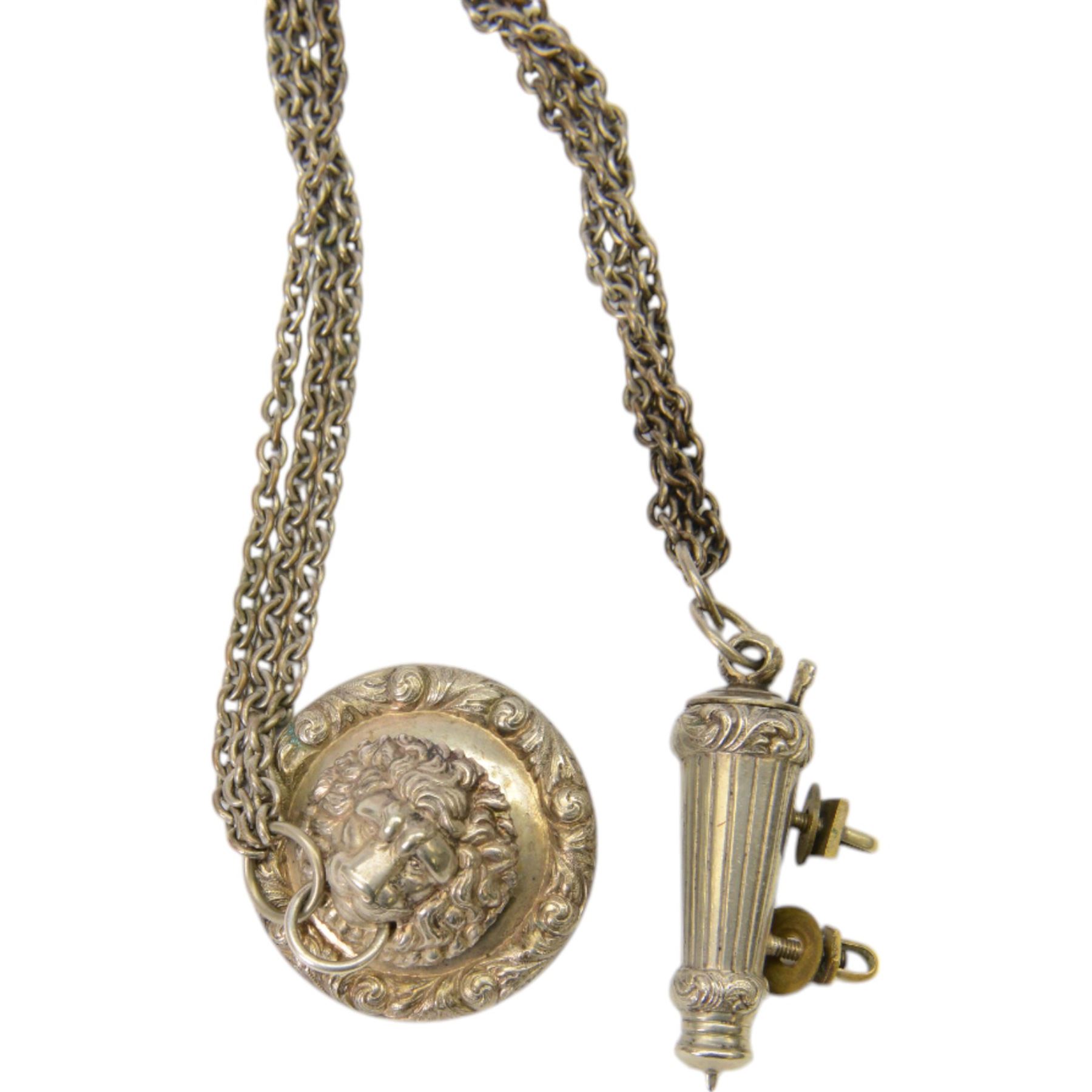British Officers cross belt fittings, consisting of lion head boss badge with chain leading to whistle in  flute holder