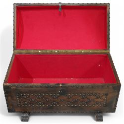 Studded leather dome top trunk, the hinged lid and front decorated with cross pattern in studs, on sledge feet 