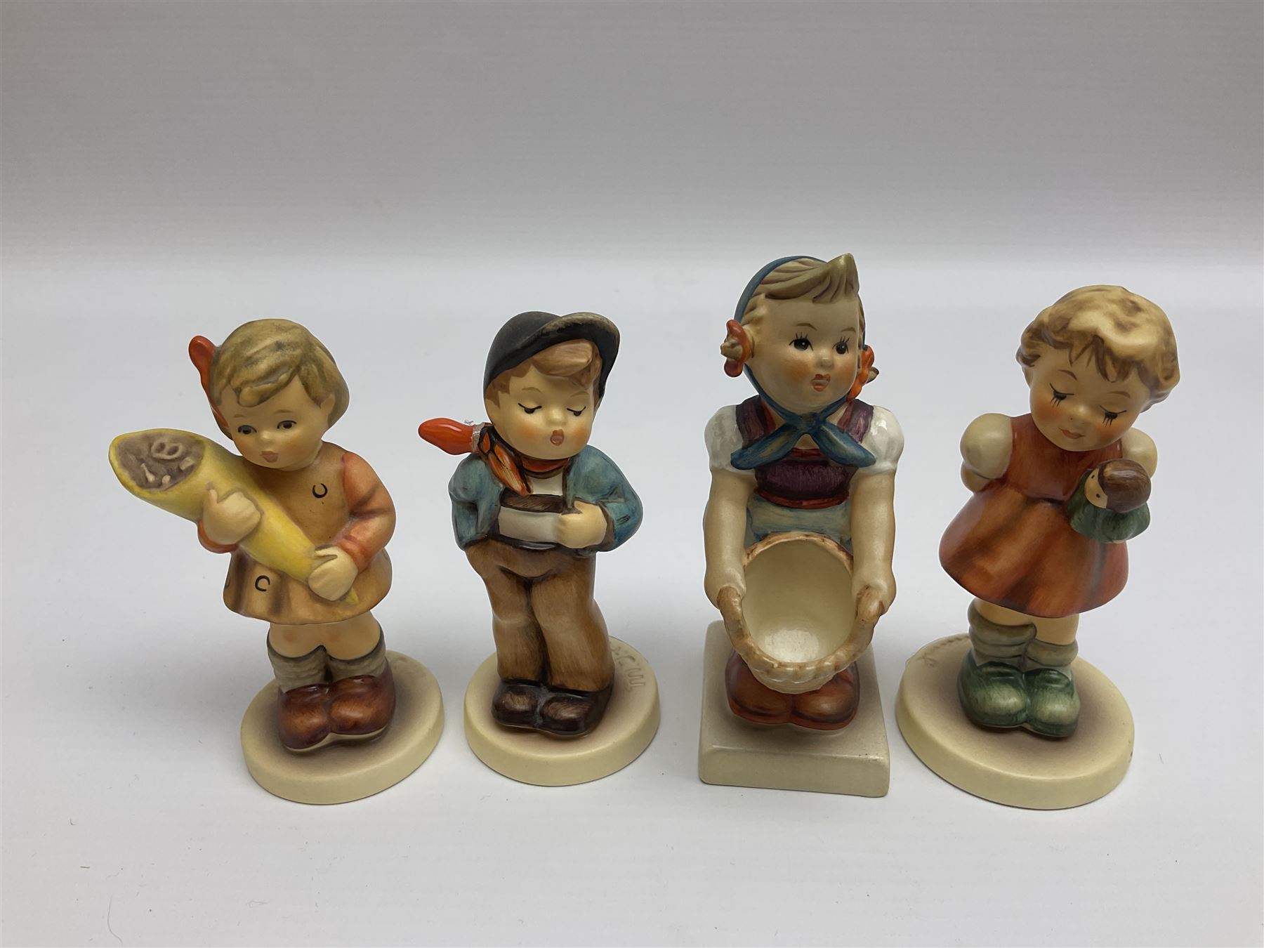 Twenty five Hummel figures by Goebel, to include Tuning up, Blessed Event, Book Worm, The Little Architect etc 