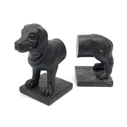 A pair of black finished composite book ends, modelled as a dachshund dog, H18cm, L24cm. 