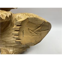 Wooden carving, modelled a bear with a salmon in its mouth, H25cm