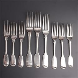 Three Victorian silver fiddle pattern table forks engraved with a crest, various dates, pa...