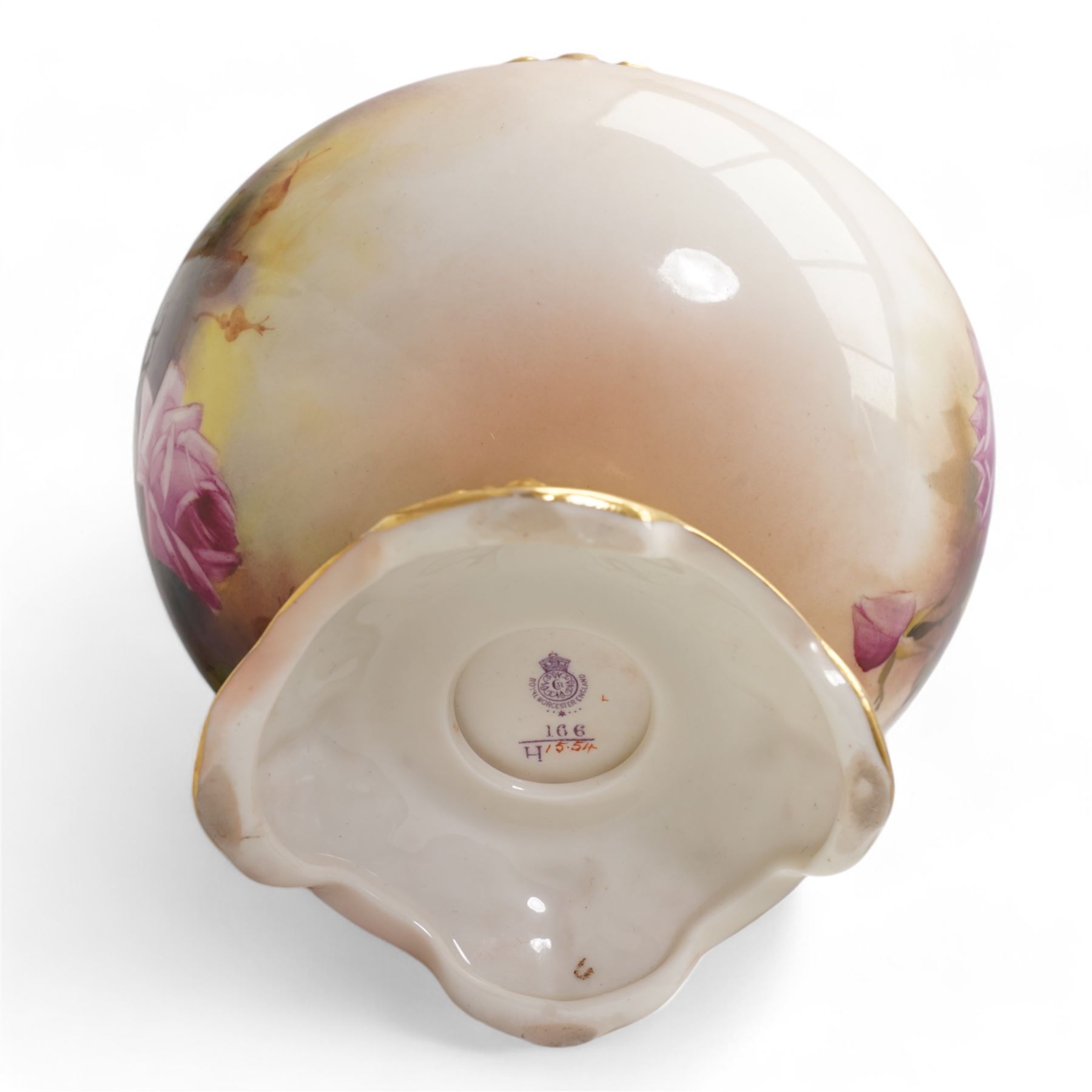 1920s Royal Worcester porcelain rose bowl, the flattened baluster body hand painted with roses and foliage, below a flared gilt pierced border, raised upon scroll moulded quatrefoil foot, shape no. H166, H13cm, together with a similarly decorated Royal Worcester bowl (2)