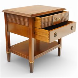 Brigitte Forestier - pair of cherry wood bedside cabinets, moulded rectangular top above two drawers, the top drawer with reeded panels flanking a brass circular pull, the lower drawer with two brass pulls, on square tapering supports united by a full length undertier