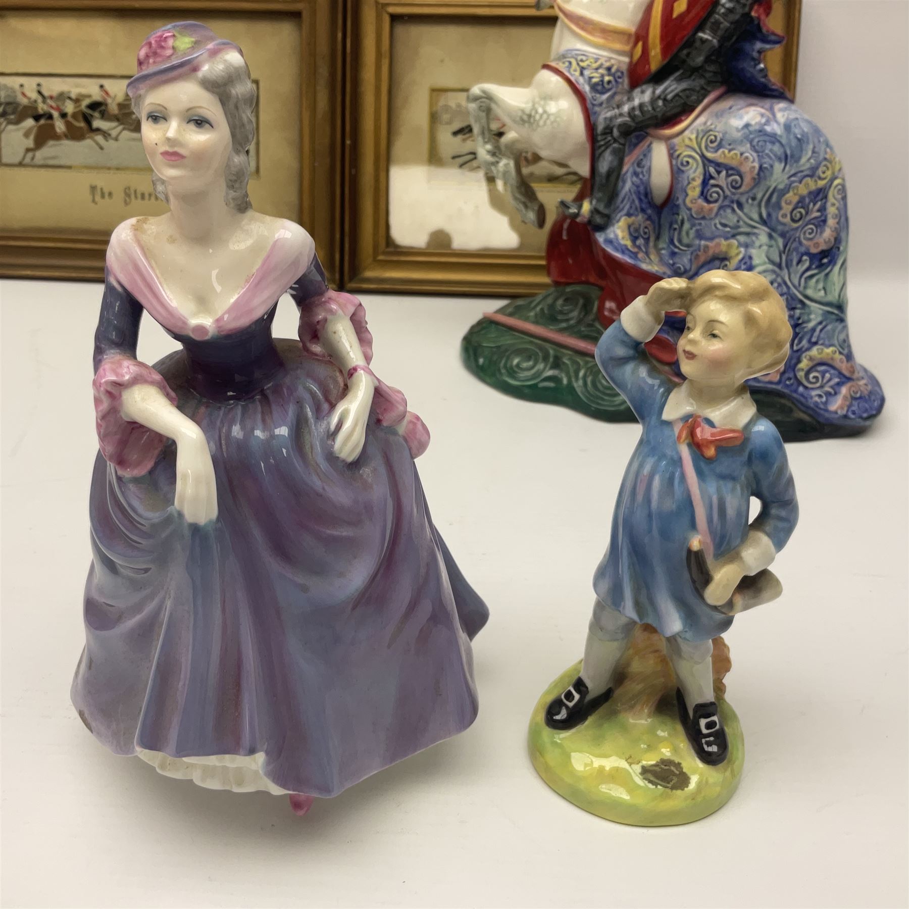 Four Royal Doulton figures, to include The Broken Lance HN 2041, The Old Balloon Seller HN 1315, The Balloon Man HN 11954 and Little Boy Blue HN 2043, together with a Coalport Ladies of Fashion figure Regina and three framed hunting silk needle works
