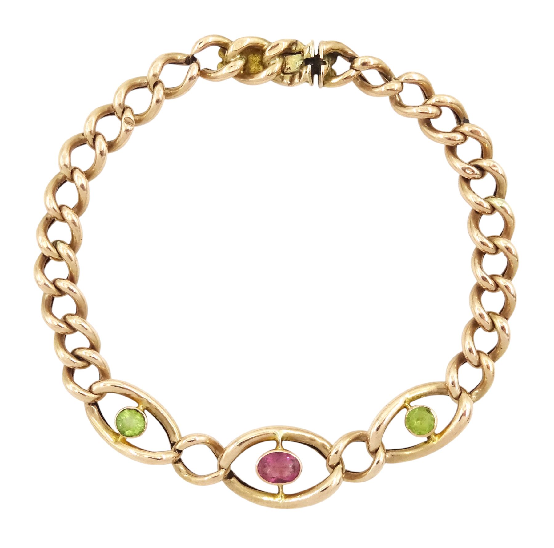 Early 20th century rose gold three stone pink tourmaline and peridot curb link bracelet, stamped 9ct