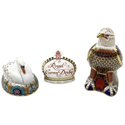 Three Royal Crown Derby paperweights, comprising bald eagle with silver stopper, swan with silver stopper and crown namestand with gold stopper  