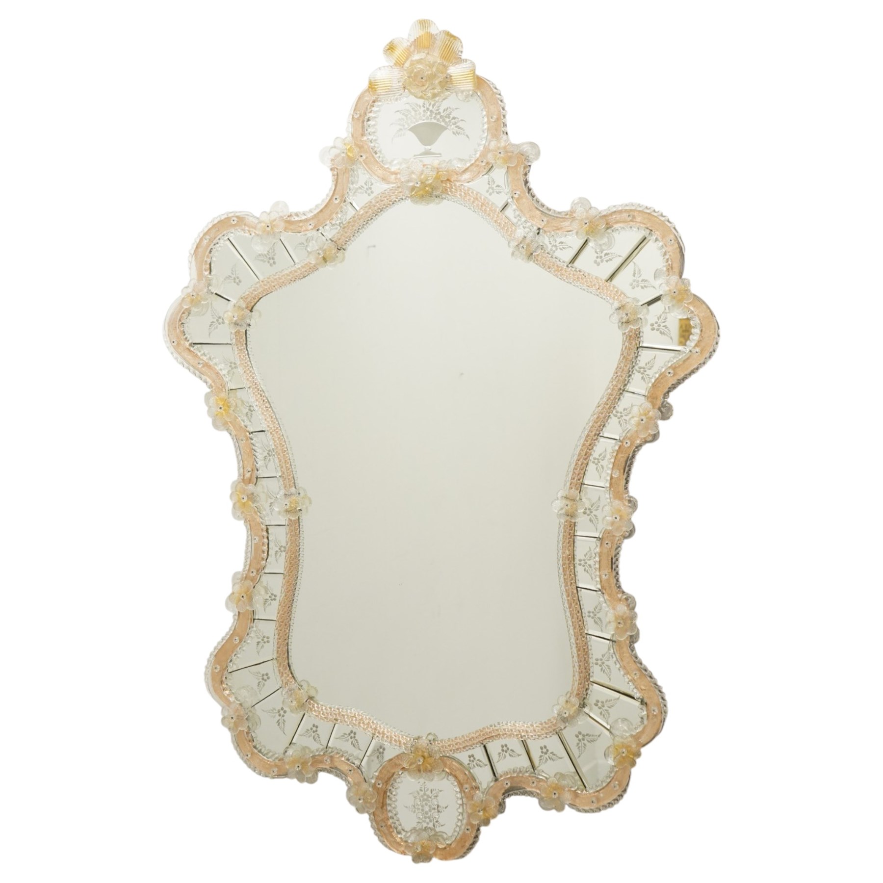 20th century Venetian glass wall mirror, the shaped plate within a mirrored frame applied with clear glass flowerheads and moulded glass edging, with etched floral decoration to the bevelled 'frameless' plates, the inner slip with ropetwist moulded glass