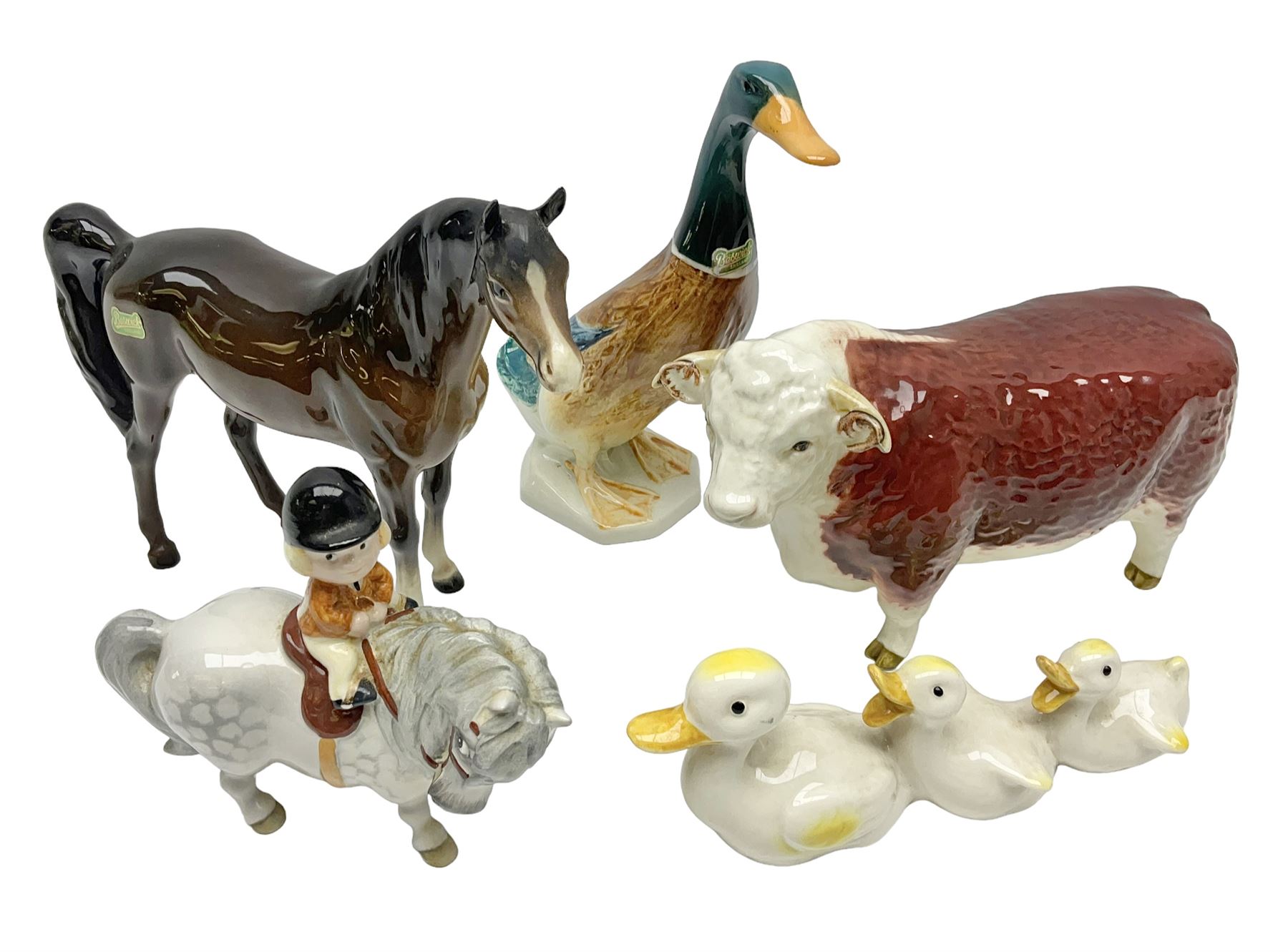 Beswick Champion of Champions Hereford bull figure no 1360, Beswick Norman Thelwell An Angel on Horseback no 2704A, and three other Beswick figures to include Arab Bay horse, Mallard and Comical Duck Family, all with printed or impressed marks beneath, largest H17.5cm