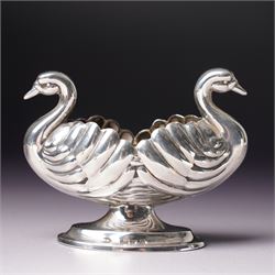 Pair of Victorian silver double headed Swan shape salts L7cm Chester 1897 Maker Florence Warden together with a pair of plated spade shape spoons 