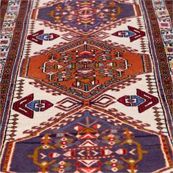 North West Persian Ardebil hand-knotted runner, ivory field decorated with row of large hexagonal medallions enclosing stylized geometric and floral motifs, linked by angular devices, within multiple geometric borders, cotton fringe ends 