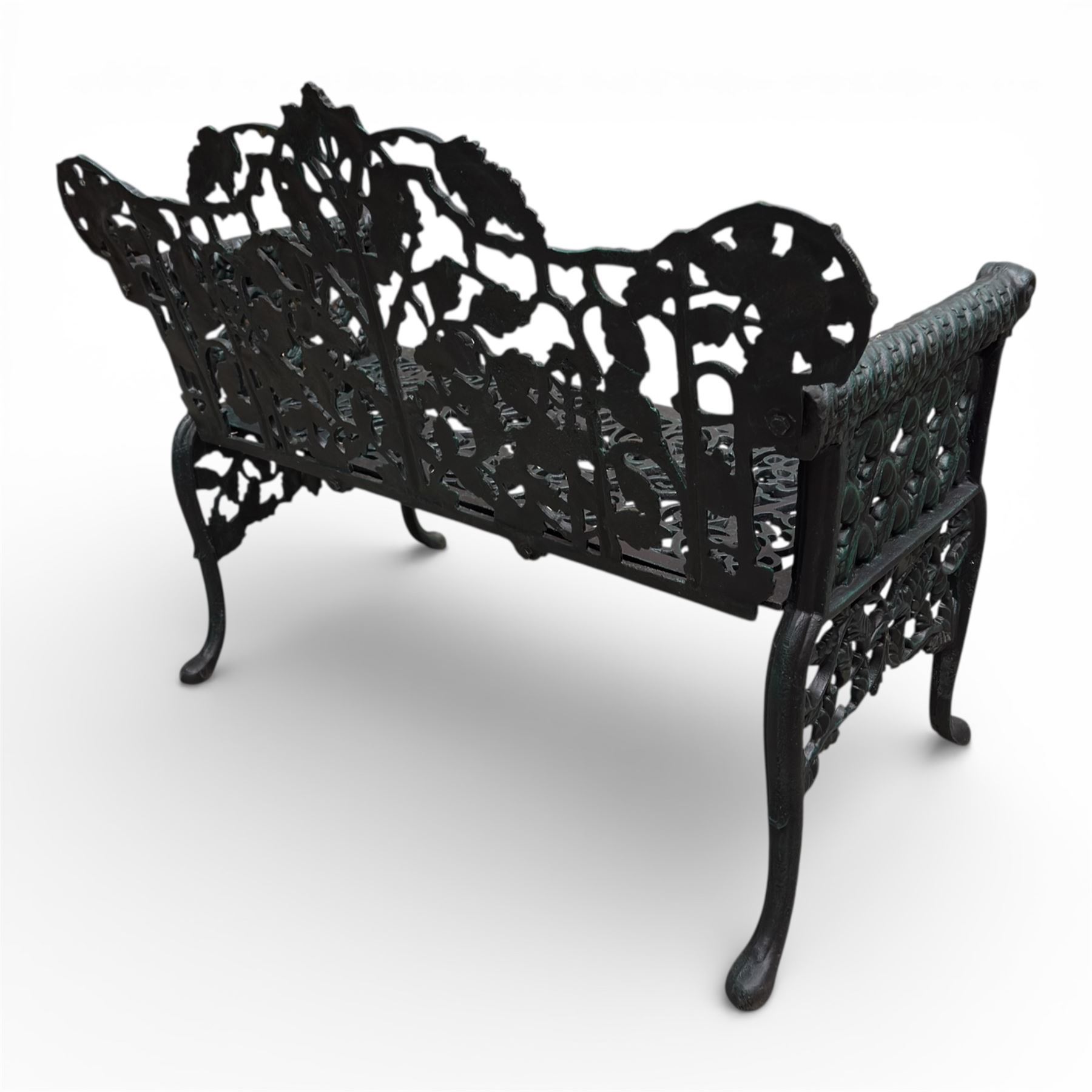 Coalbrookdale style - cast iron garden bench, with pierced foliate back, rams head arms, raised on cabriole legs, finished in green paint.