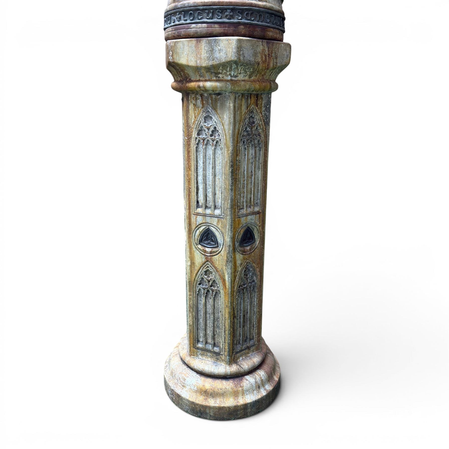 Farran stone garden statue depicting a hooded monk standing in flowing robes in circular form, set upon Gothic pedestal with arched panels, featuring lead hands and script band