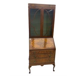 Early 20th century walnut bureau bookcase, two glazed doors over fall front, fitted with three drawers, on shell carved cabriole feet