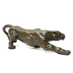 Bronze figure, modelled as a cougar in crouching pose, after Milo and with foundry mark, L42cm 