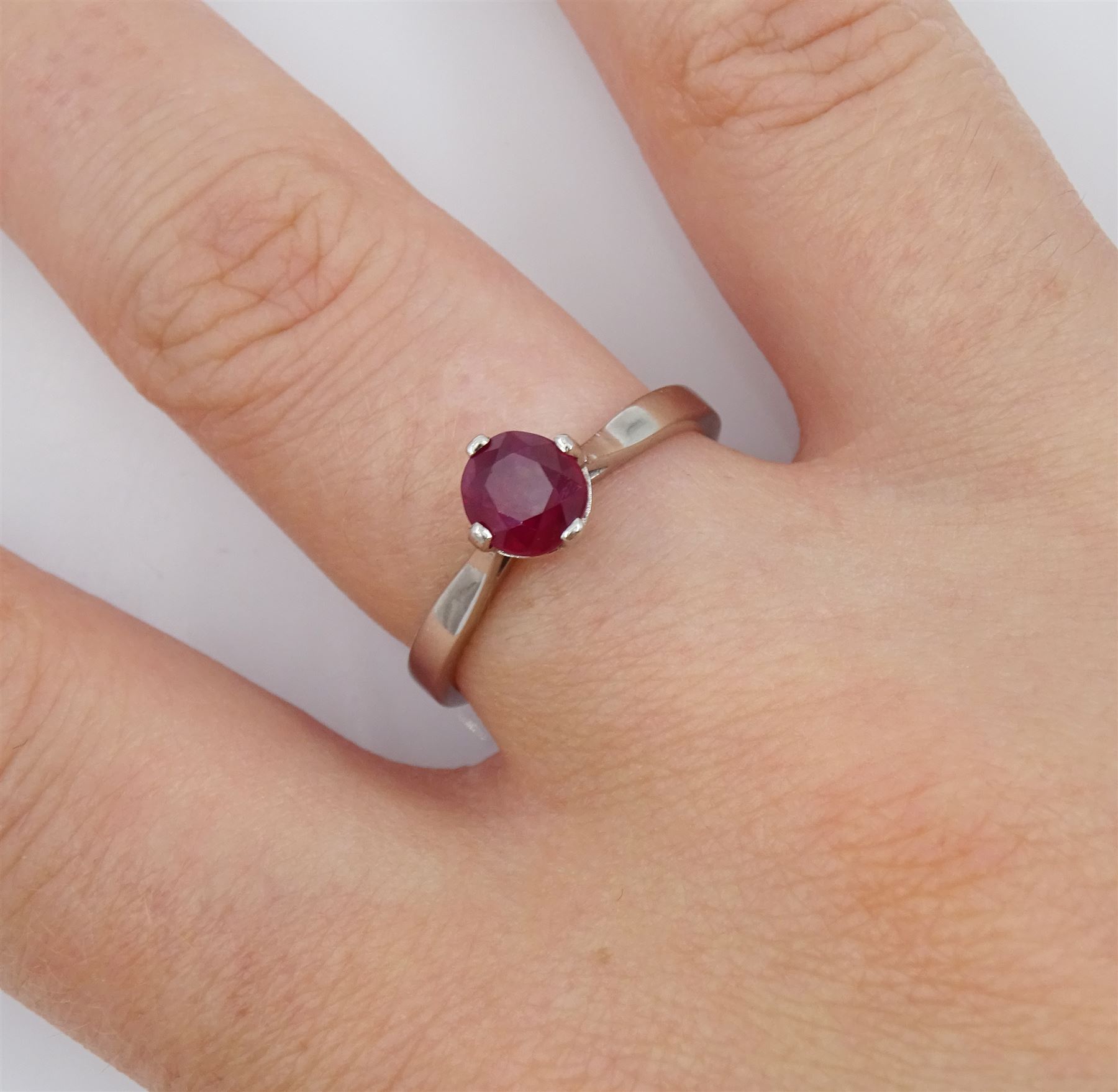 Platinum ruby ring, four claw set with a single oval cut ruby of approx 1.00 carat hallmarked