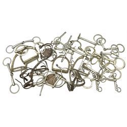 Horse riding - seventeen nickel horse bits, two pairs of stirrups and four pairs of nickel spurs