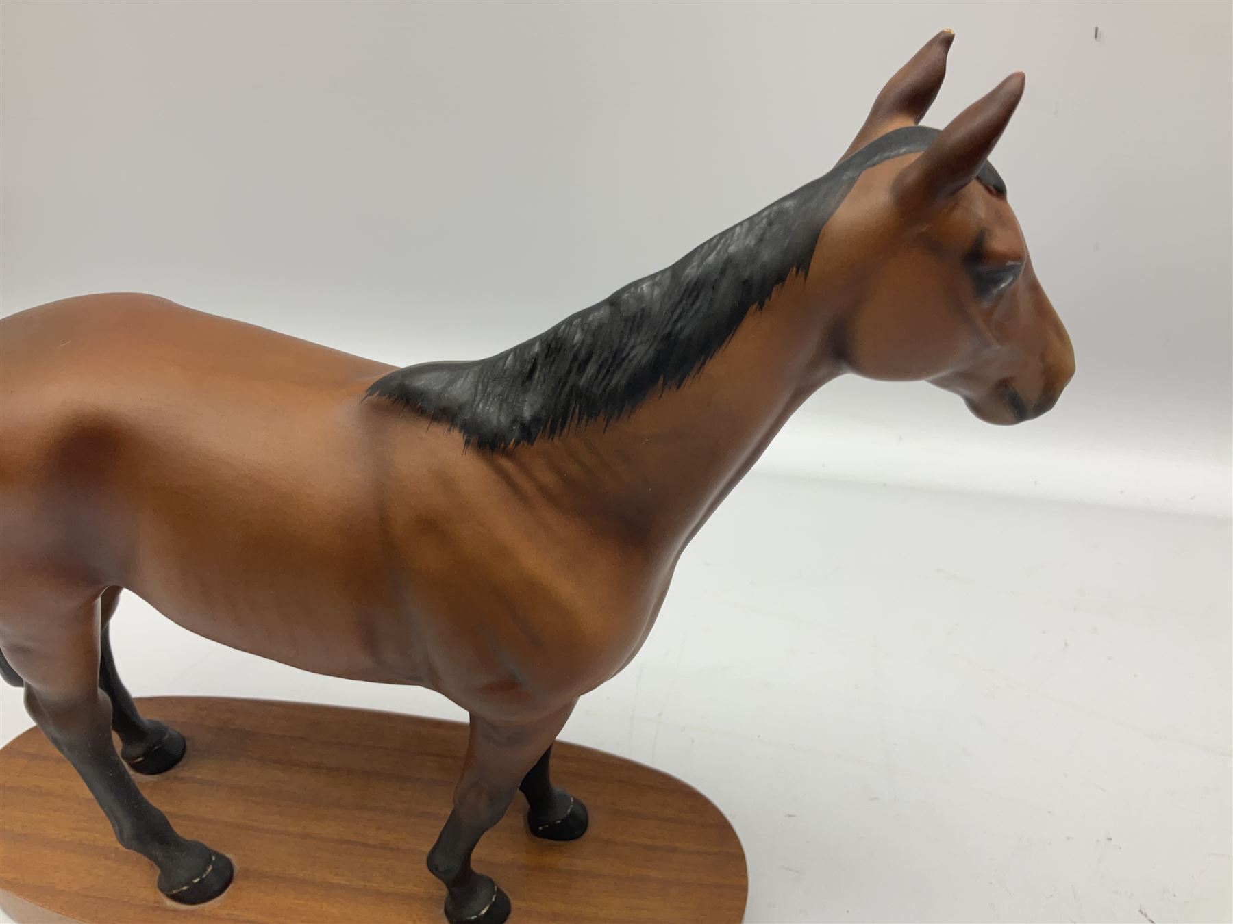 Beswick 'Mill Reef' horse figure, on a wooden plinth together with Beswick Ware horse figure 'Red Rum' on wood plinth, both with printed mark beneath