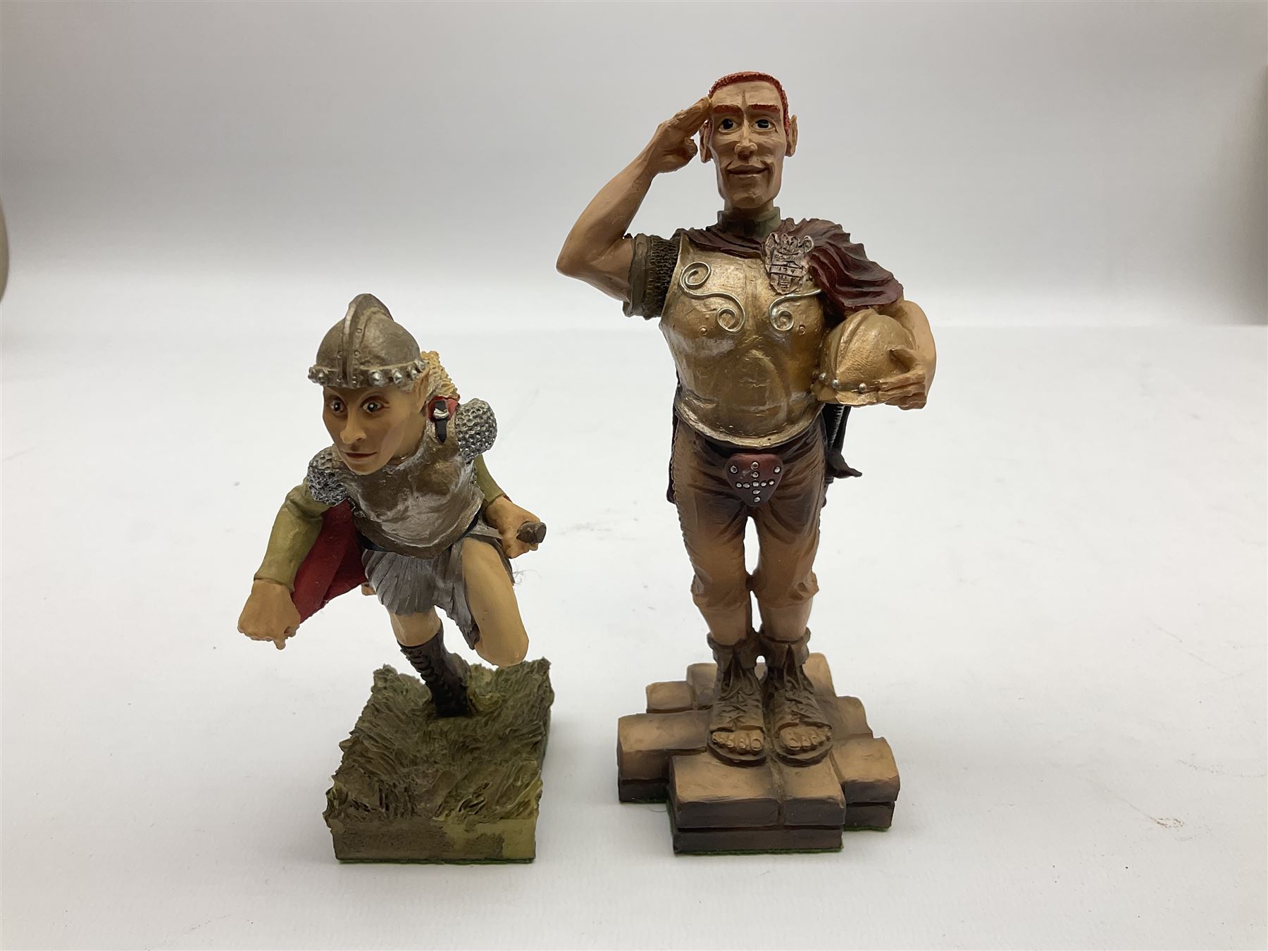 Terry Pratchett Discworld figures, designed by Clarecraft, comprising Captain Vimes DW54, in box, Angua DW66, in box, Angua as a wolf DW102, Sergeant Colon DW30, Corporal Nobbs DW80, Captain Carrot DW100, Cuddy the Dwarf DW106, together with a Tourist Guide to Lancre a Discworld Mapp