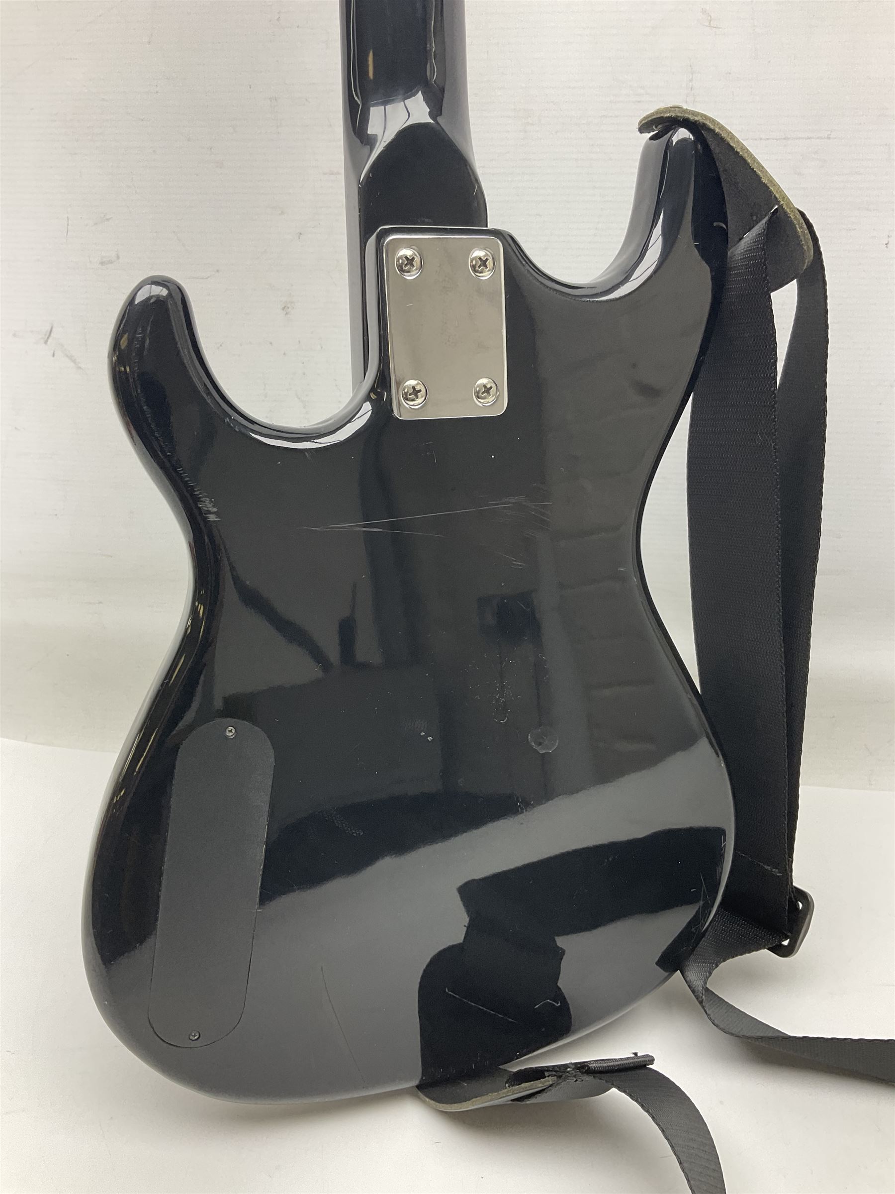 Encore black electric cut-away guitar L96cm; and Spanish Victor Garcia model 187 acoustic guitar, bears label dated 1972 L99cm; each in soft carrying case (2)