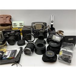 Vintage and later cameras, lenses, accessories and darkroom equipment including Zenit 12XP camera, Praktica BX20 camera fitted with 'Sigma Zoom Master 1:3.5-4.5 f=35-70mm' lens, Praktica LLC camera fitted with 'Carl Zeiss Jena Pancolar 1.8/50' lens, Canon Zoom Lens 'EF 100-300mm 1:5.6', various Jessop and other makers darkroom items including safelight (Red), universal duo tank, multi-mask enlarging easel etc, in three boxes