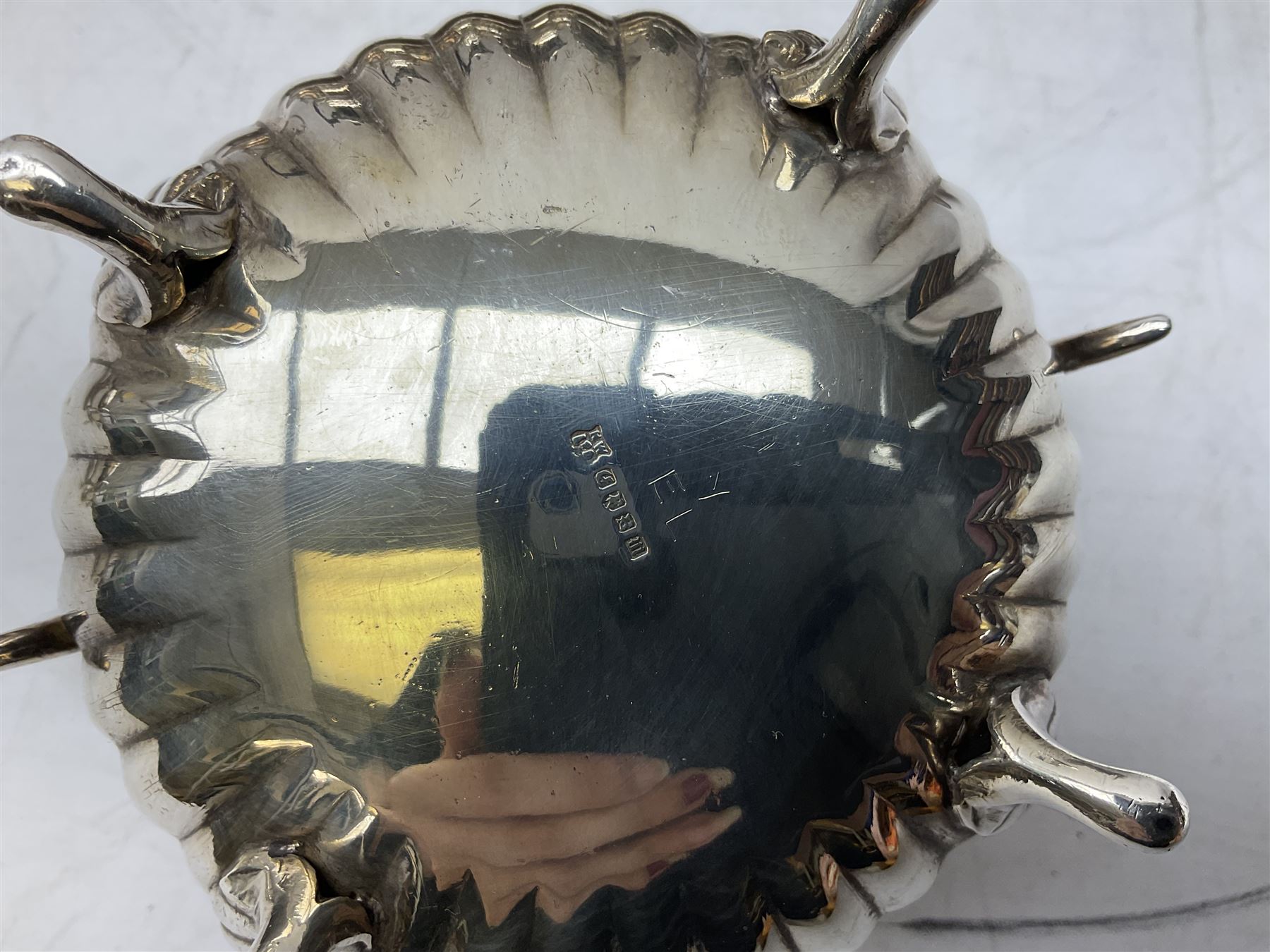 Early 20th century hallmarked silver trumpet vase stamped J & R Griffin (Joseph & Richard Griffin), Chester 1917, with weighted base, together with a 19th century silver-plate biscuit barrel by JK&Co, ornately engraved throughout, John Round & Son silver plated twin handled cup, and other silver plated and other metal ware to include ornate teapots, tray etc