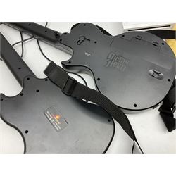 Nintendo Wii console, four controllers with cases and four nunchucks, Wii sensor bar, balance board and dance mat. Guitar hero wireless guitar for Wii and Redoctane wired guitar. Nintendo DS lite handheld gaming console, console and game cases and Guitar Hero Redoctane Guitar Grip. Selection of Nintendo Wii and Nintendo DS lite games to include Super Mario Galaxy, Guitar Hero, Wii Fit, Legend of Zelda games etc. Archos AV400 Series pocket video recorder with accessories, cradle and remote, in three boxes