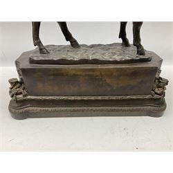 Large and impressive bronze figure of Wellington seated on a horse, on a sarcophogus shaped stepped base impressed 'Meunier Paris', the canted corners inset with battle trophies H68cm L50cm D22cm