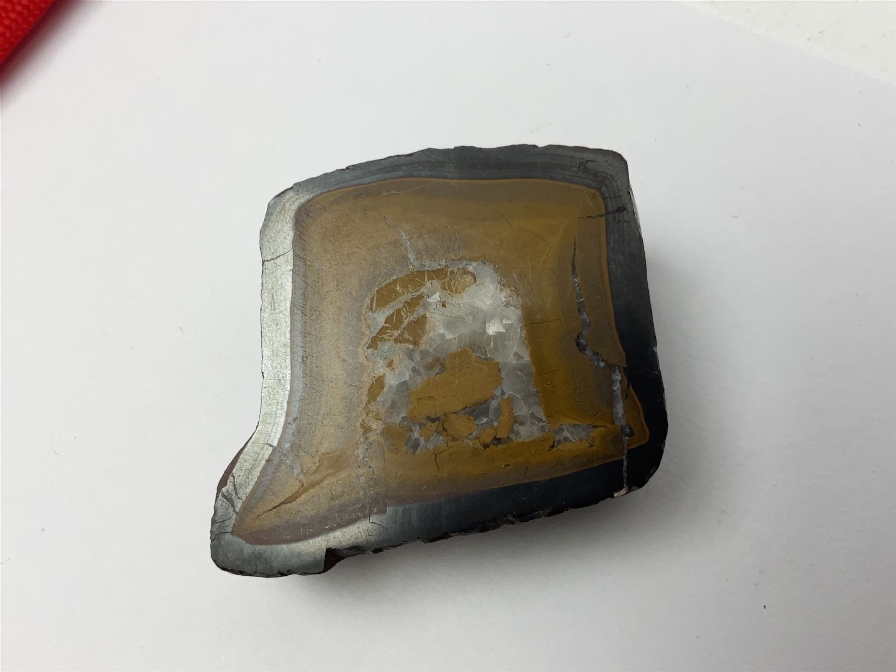 Chinese hardstone carving of a fish amongst coral, with platted rope handle, together with other hardstone and soft stone carvings  