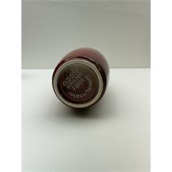 Poole pottery Form vase by Andrew Tanner, decorated with a silhouette of a tree beneath a red sun, together another with Poole pottery vase and dolphin, largest H24cm 